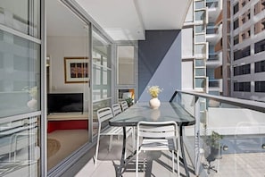 Enjoy a comfortable stay in this stylish apartment with a balcony, seating area, and flat-screen TV.