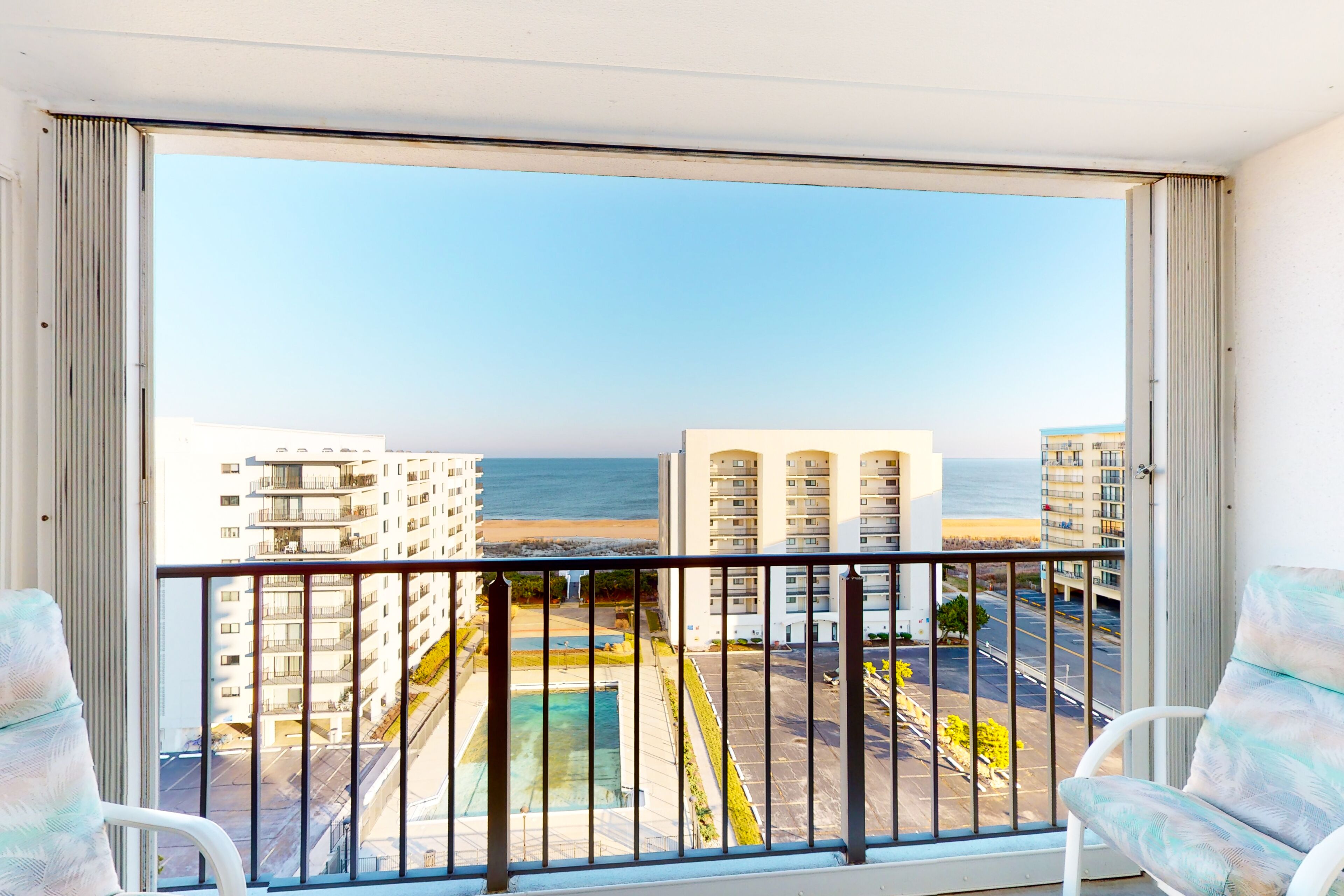 Oceanfront condo with a pool, tennis court, balcony, W/D, and central AC