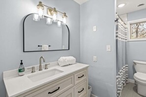 Bathtub, hair dryer, towels