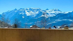 A mountain view with a satellite dish in the foreground.
