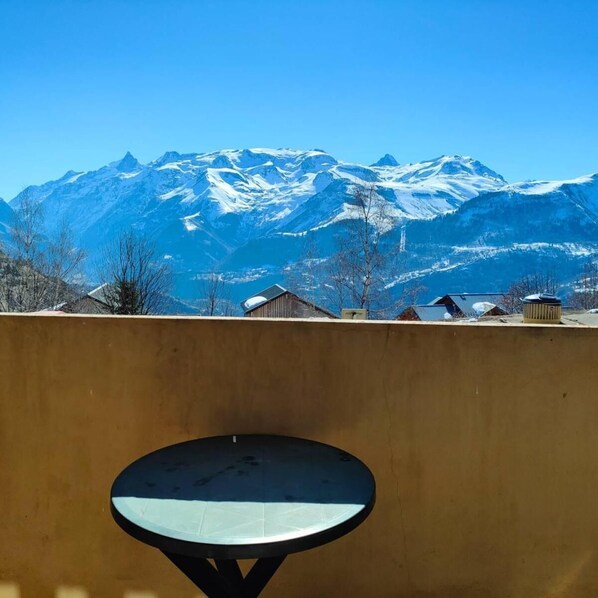 A mountain view with a satellite dish in the foreground.