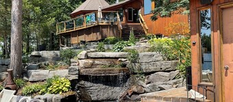 Beautiful south facing lakefront cottage with sauna & hot tub on Big Cedar Lake!