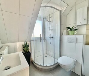 Shower, hair dryer, towels, soap