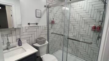 Shower, hair dryer, towels, soap