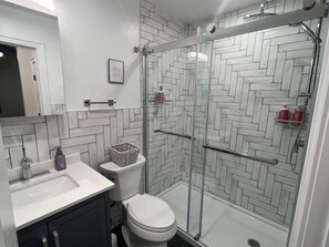 Shower, hair dryer, towels, soap