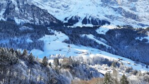 A snow-covered mountain landscape with a clear sky. - Gasthaus Schwand (Engelberg)