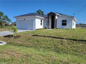 Stroll up to this charming single-story home with a garage and inviting porch.