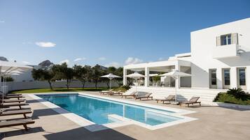 Seasonal outdoor pool, open 9:00 AM to 8:00 PM, pool umbrellas