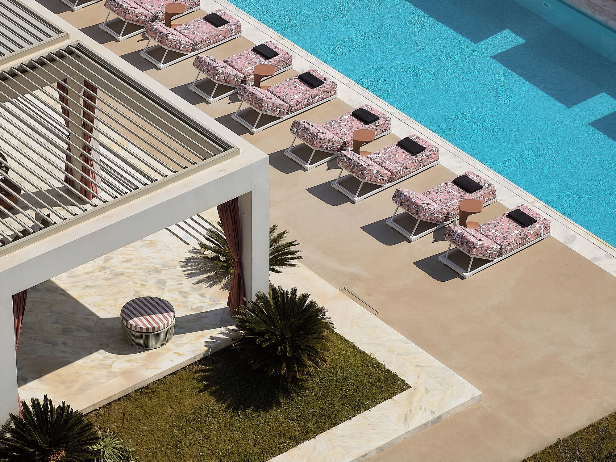 Seasonal outdoor pool, open 9:00 AM to 8:00 PM, pool umbrellas