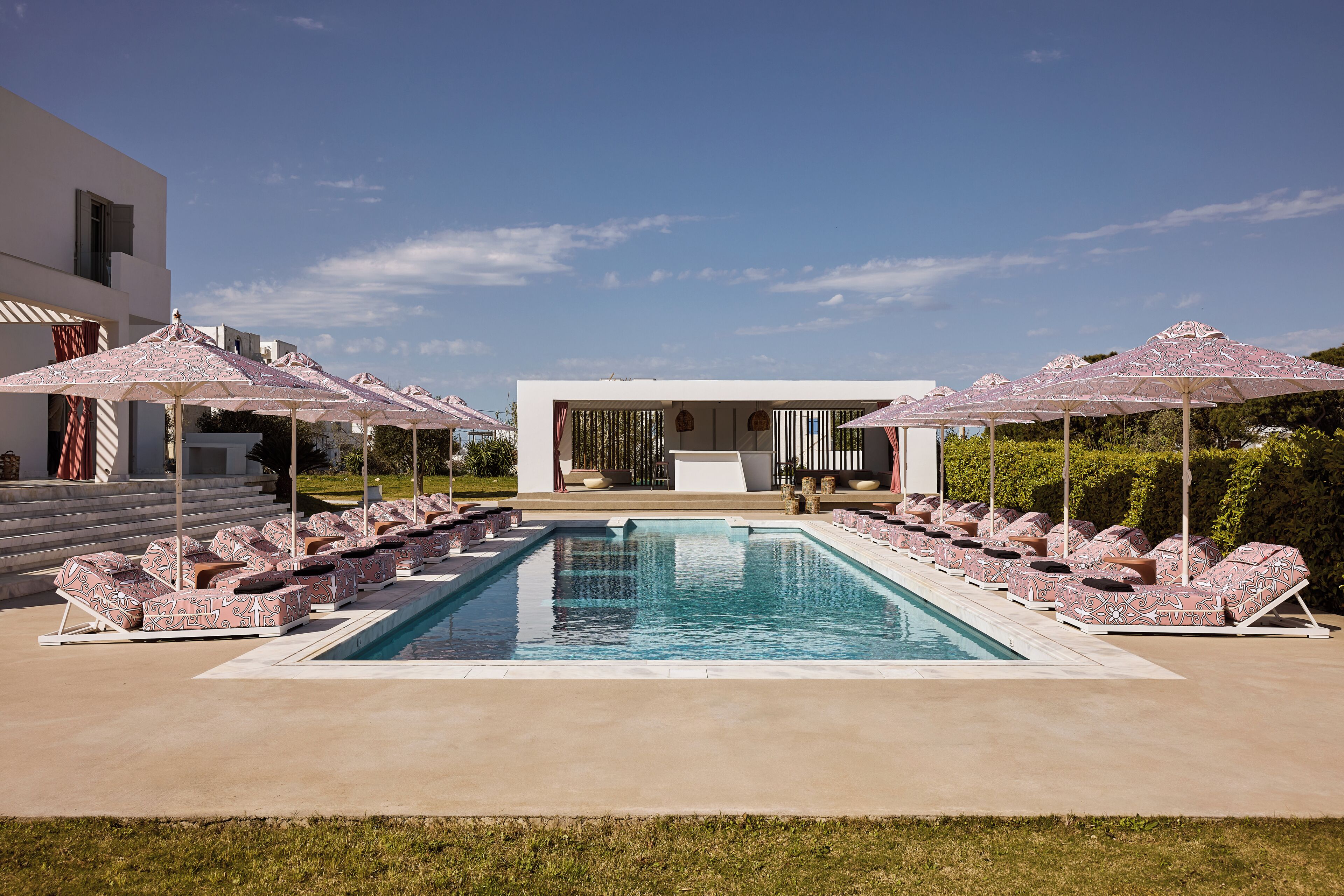 Seasonal outdoor pool, open 9:00 AM to 8:00 PM, pool umbrellas