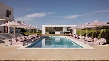 Seasonal outdoor pool, open 9:00 AM to 8:00 PM, pool umbrellas