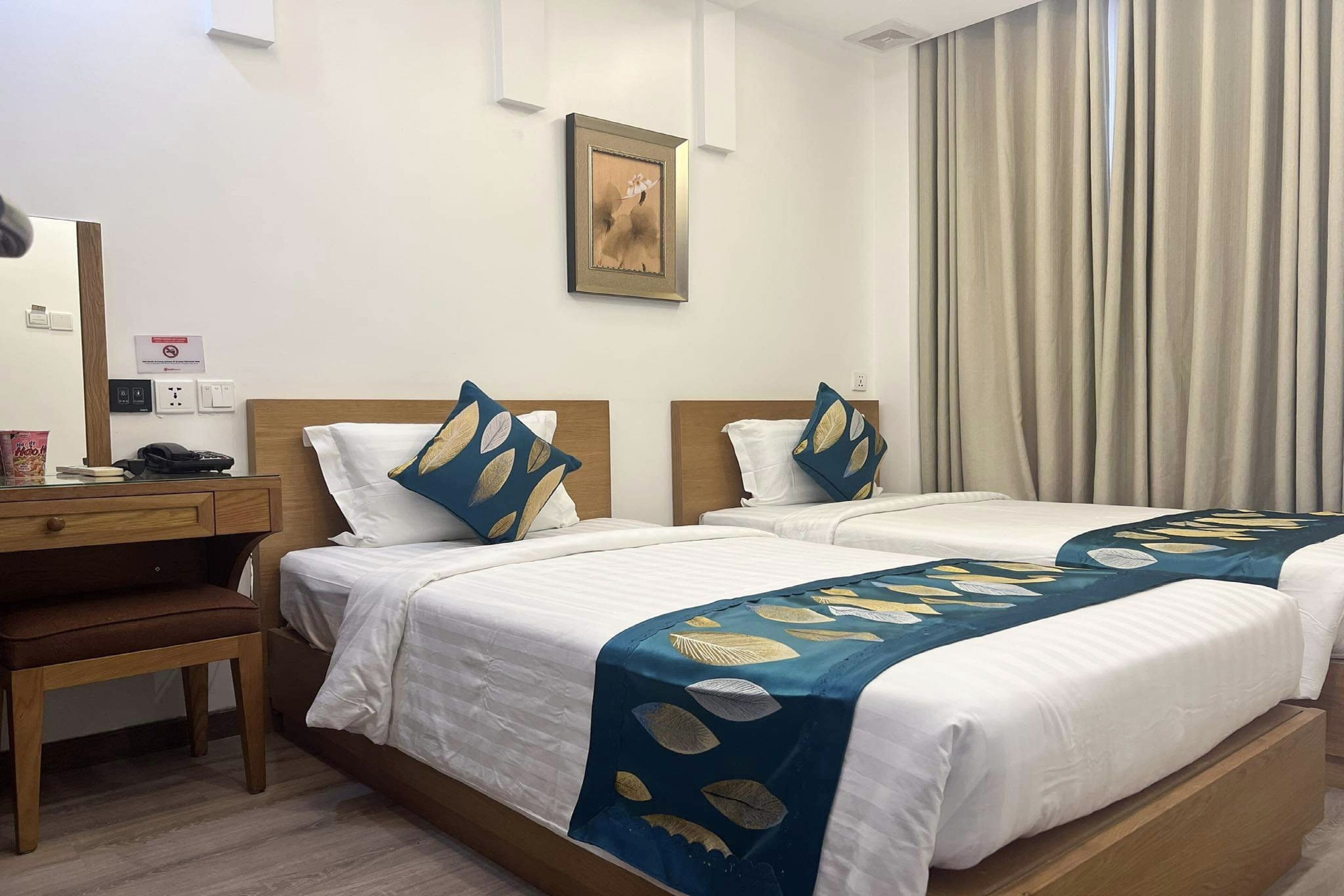 Quarto duplo luxo | Frigobar, escrivaninha, quartos à prova de som, Wi-Fi de cortesia