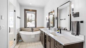 Combined shower/bathtub, hair dryer, towels, soap - The Sunrise Ridge Chalet (Whitefish)