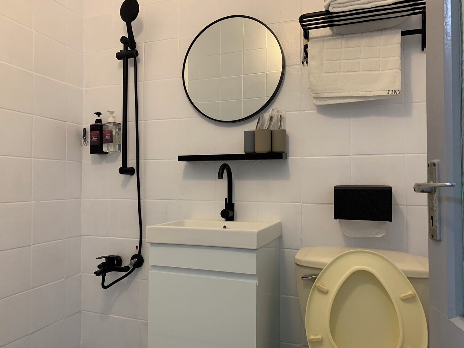 Shower, hair dryer, towels, shampoo