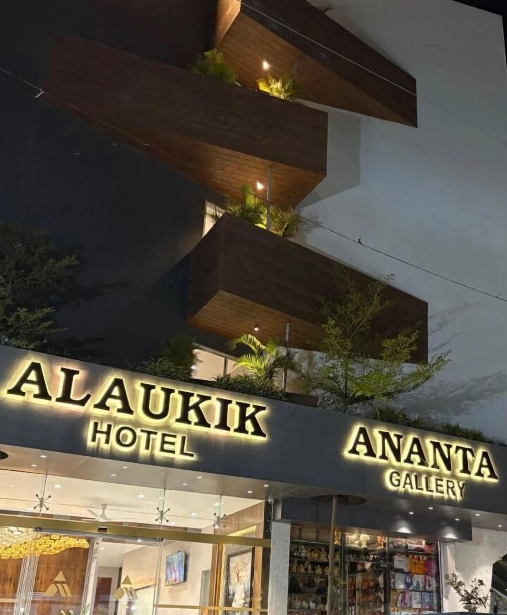 A hotel with a modern design, featuring balconies with plants and a sign for 'Ananta Gallery' below the hotel name.