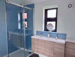 Shower, hair dryer, towels, toilet paper
