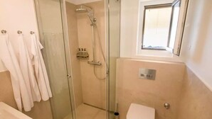 Shower, hair dryer, towels, soap