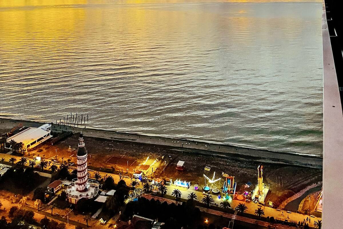 A coastal view with a tower and beach area.