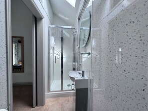 Shower, hair dryer, towels, toilet paper