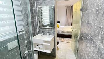 Shower, hair dryer, towels, soap