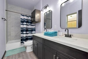 Shower, hair dryer, towels, soap - Modern, Cozy 4 Bedroom home in Northeast Houston (Houston)