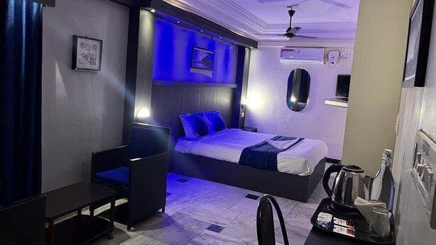 A modern hotel room with a bed, a desk, a chair, and a coffee machine. - Sivabhagya SKR Madurai (Madurai)