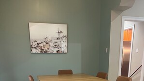A dining area with a rectangular wooden table surrounded by six chairs. - Near Hospital & Shopping Centers- 3/2 with pool (Lafayette)