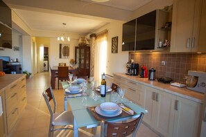Villa | Private kitchen | Fridge, microwave, oven, stovetop
