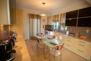 Villa | Private kitchen | Fridge, microwave, oven, stovetop