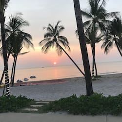 On the beach, white sand, sun-loungers, beach umbrellas