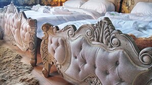 A luxurious bedroom with ornate, tufted headboards and a plush, patterned rug. - Deluxe 4/5 Bed Hot Tub Cinema Room 15 (Halstead)