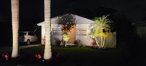 A modern house with a garage, a driveway, and a well-maintained lawn.