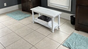 A bathroom with a dark gray wall, a white vanity, a mirror, and a window with blinds. - Country Comfort and Views - 10 minutes from restaurants. (Newburgh)