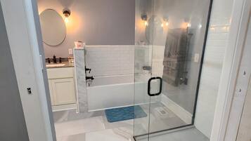 Shower, hair dryer, towels, soap