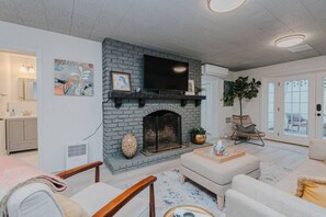 TV, fireplace, books, stereo