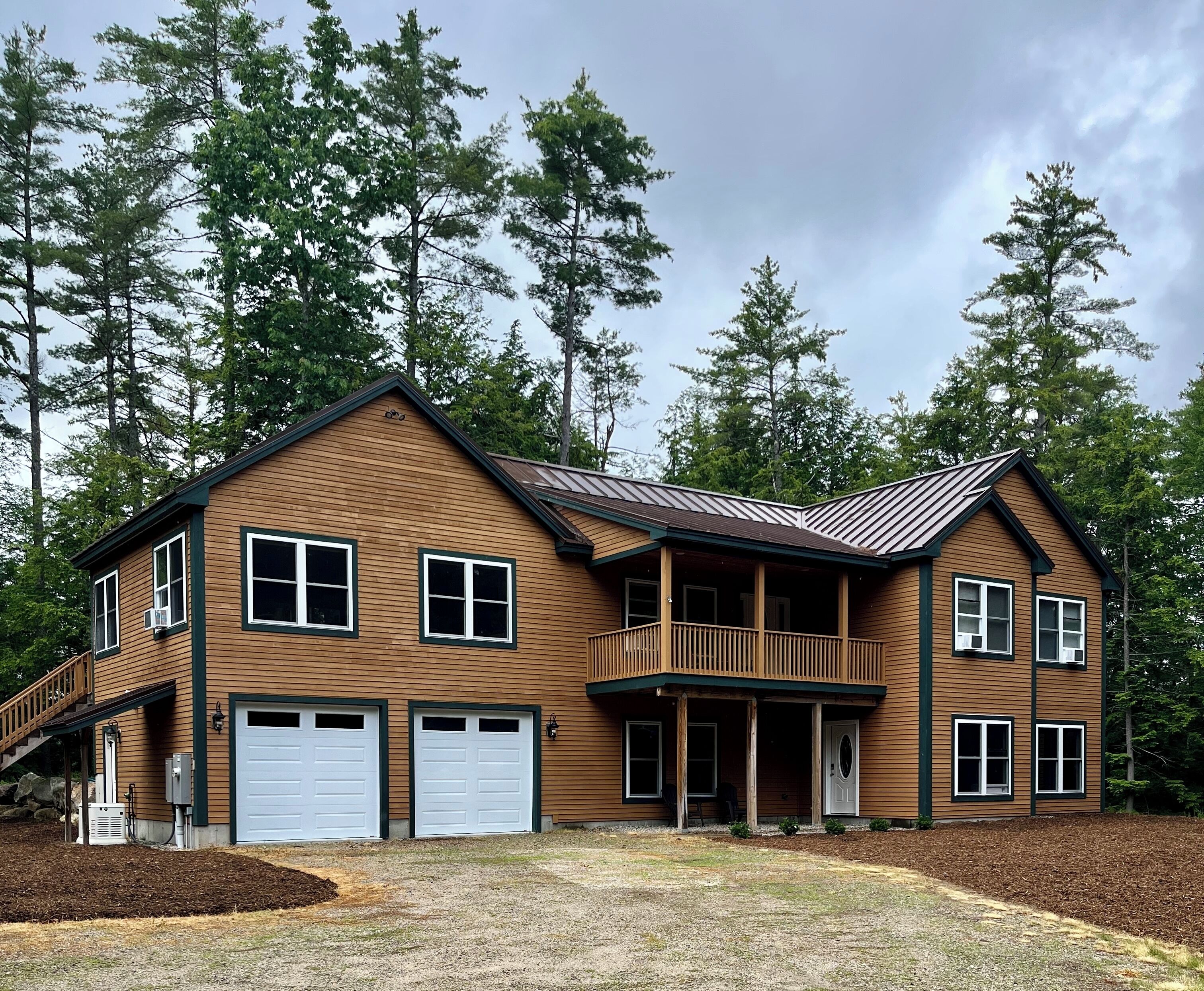 Beautiful lakefront home on ten acres with private dock, large deck and fire pit