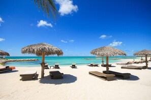 On the beach, sun-loungers, beach towels