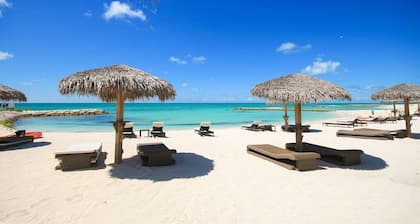 Breathtaking Pool Front 3-Bedroom Condo, Just 8-Min Walk to Pristine Beach!