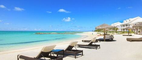 On the beach, sun loungers, beach towels