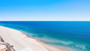 A beach with a clear view of the ocean and a sandy shoreline. - Crystal Shores West 1401 | Guest Favorite! Gorgeous updates! Endless views! (Gulf Shores)