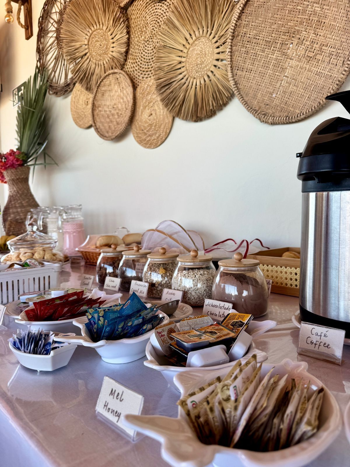 A breakfast buffet with various food items and coffee options.