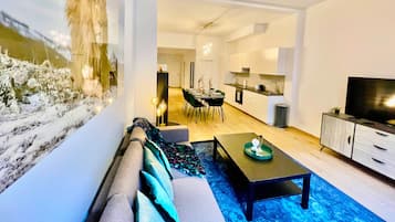 Deluxe Apartment, 2 Bedrooms | Living room | 42-inch Smart TV with digital channels, TV