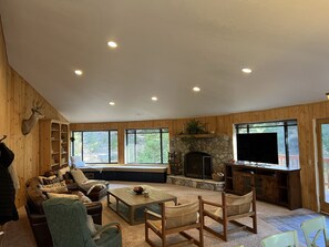 Smart TV, fireplace, foosball, books