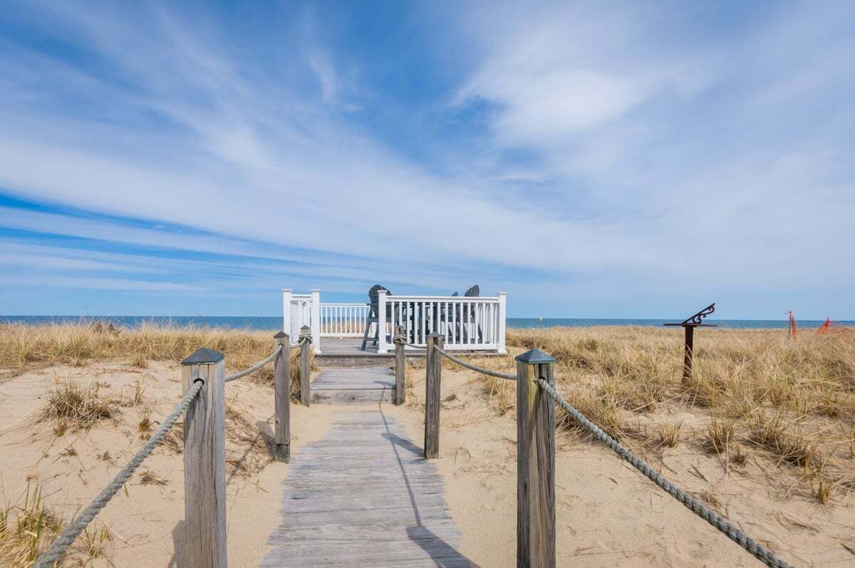 This enchanting cottage set atop the dunes of Sagamore Beach offers a vacation lifestyle you'll love