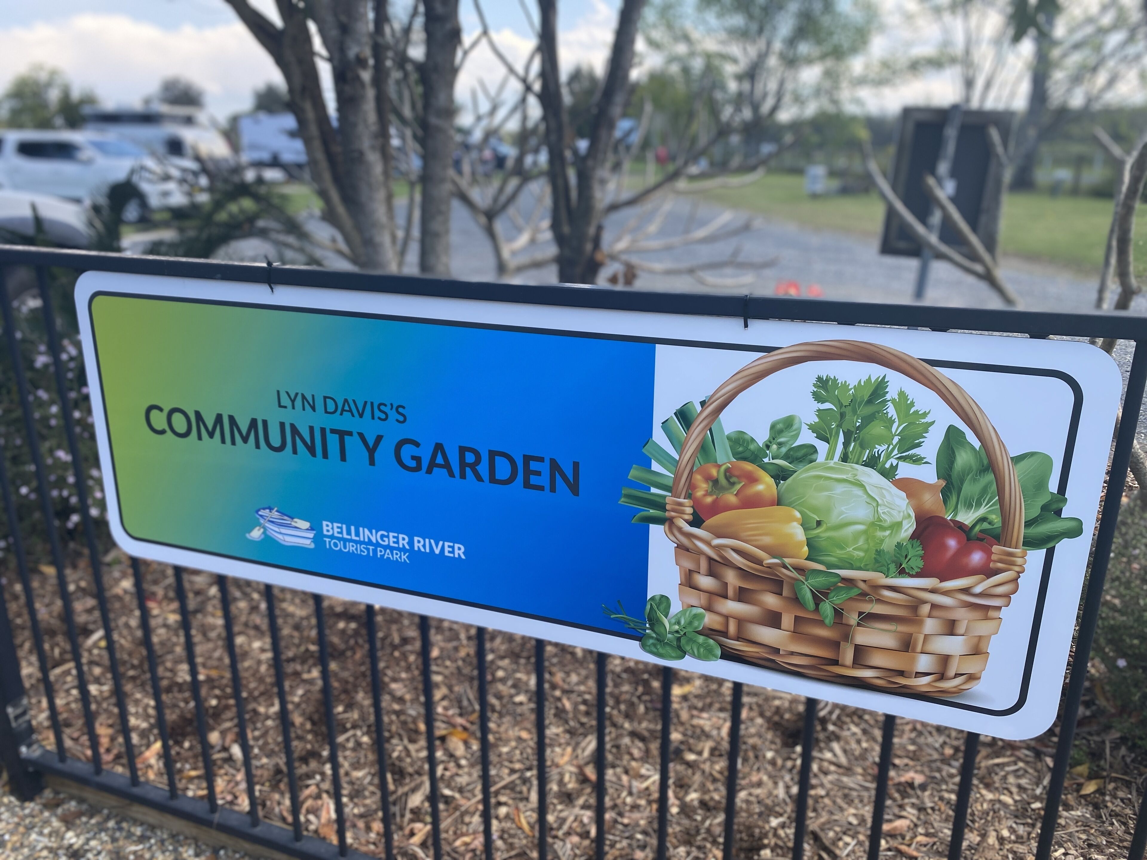 A sign for Lyn Davis's Community Garden at Bellinger River Tourist Park.