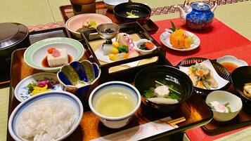 A traditional Japanese meal set with various dishes and utensils on a tray.