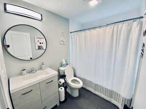 Bathtub, hair dryer, towels