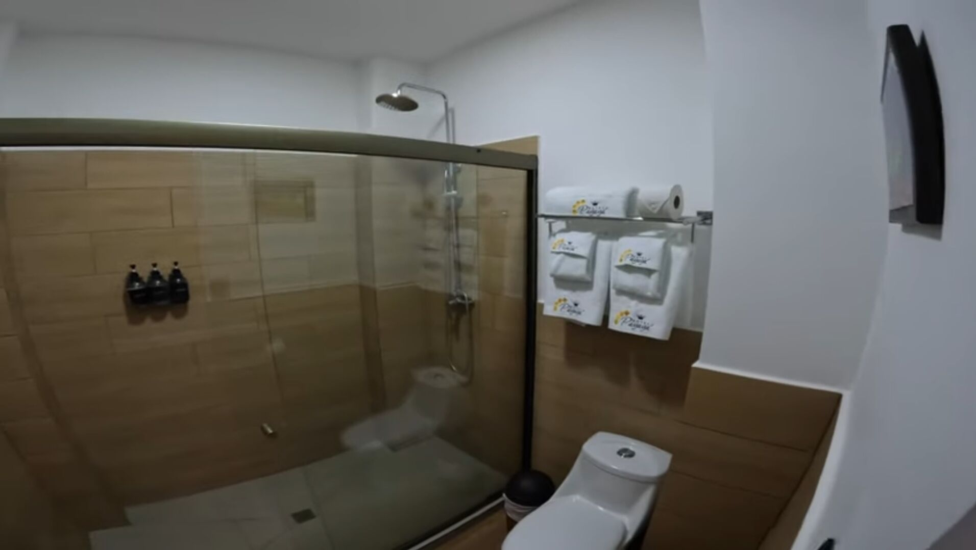 Shower, rainfall showerhead, hair dryer, towels