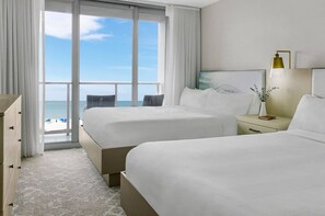 Enjoy stunning beach views from the balcony, featuring two comfortable beds and a serene atmosphere.