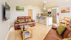A modern apartment with a living room, kitchen, and dining area. - 2 bedroom accommodation in Holton Heath (Holton Heath)